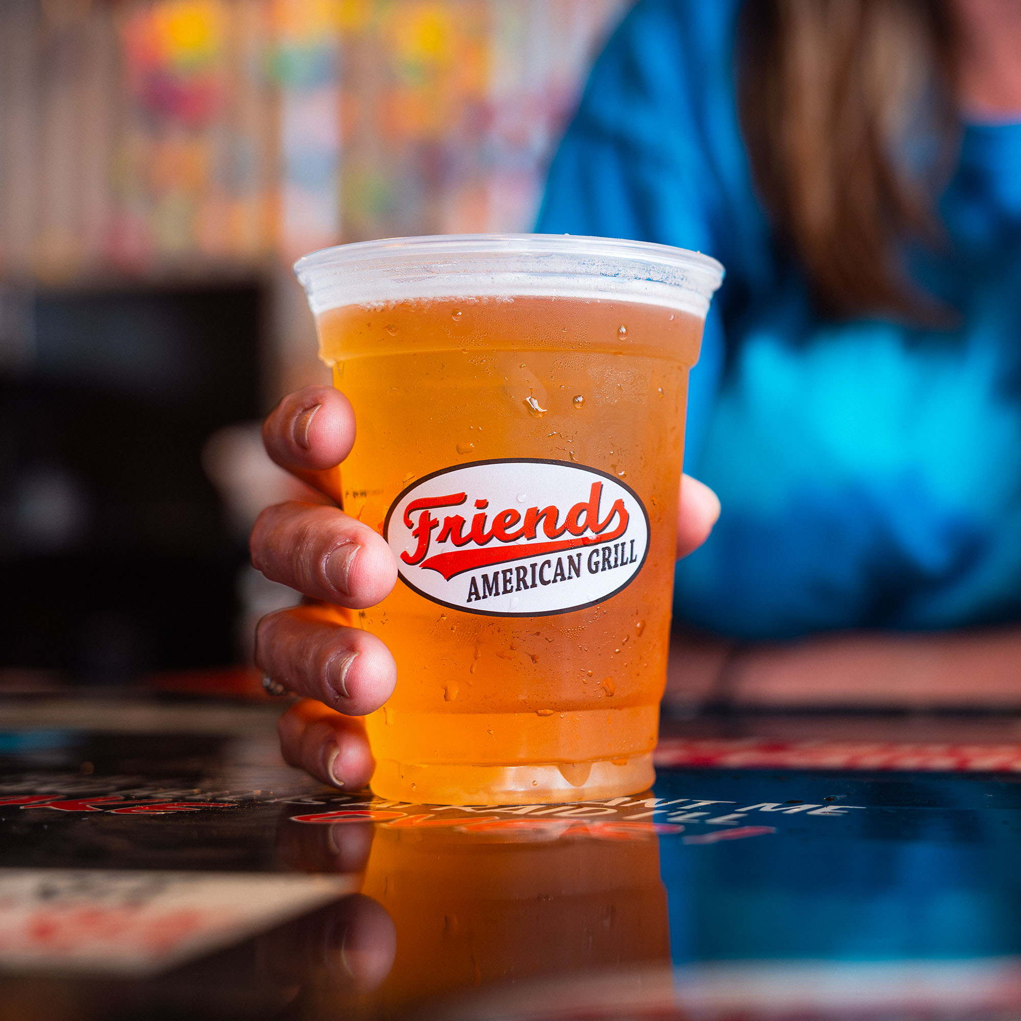 Woman holding a beer
